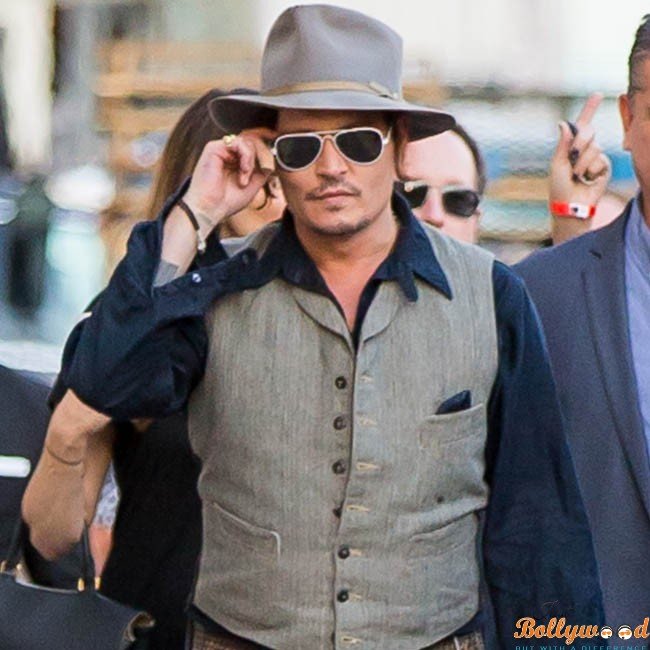 Johnny Depp signs autographs for his fans at Jimmy Kimmel Live! in Hollywood, CA