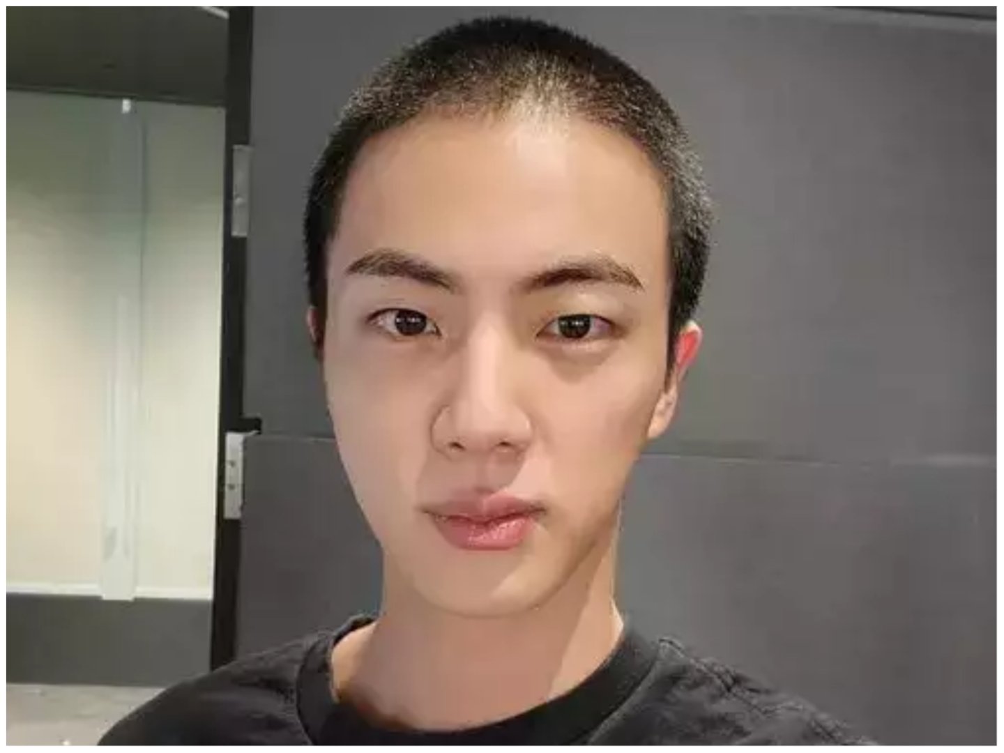 BTS' Jin in a shaved head